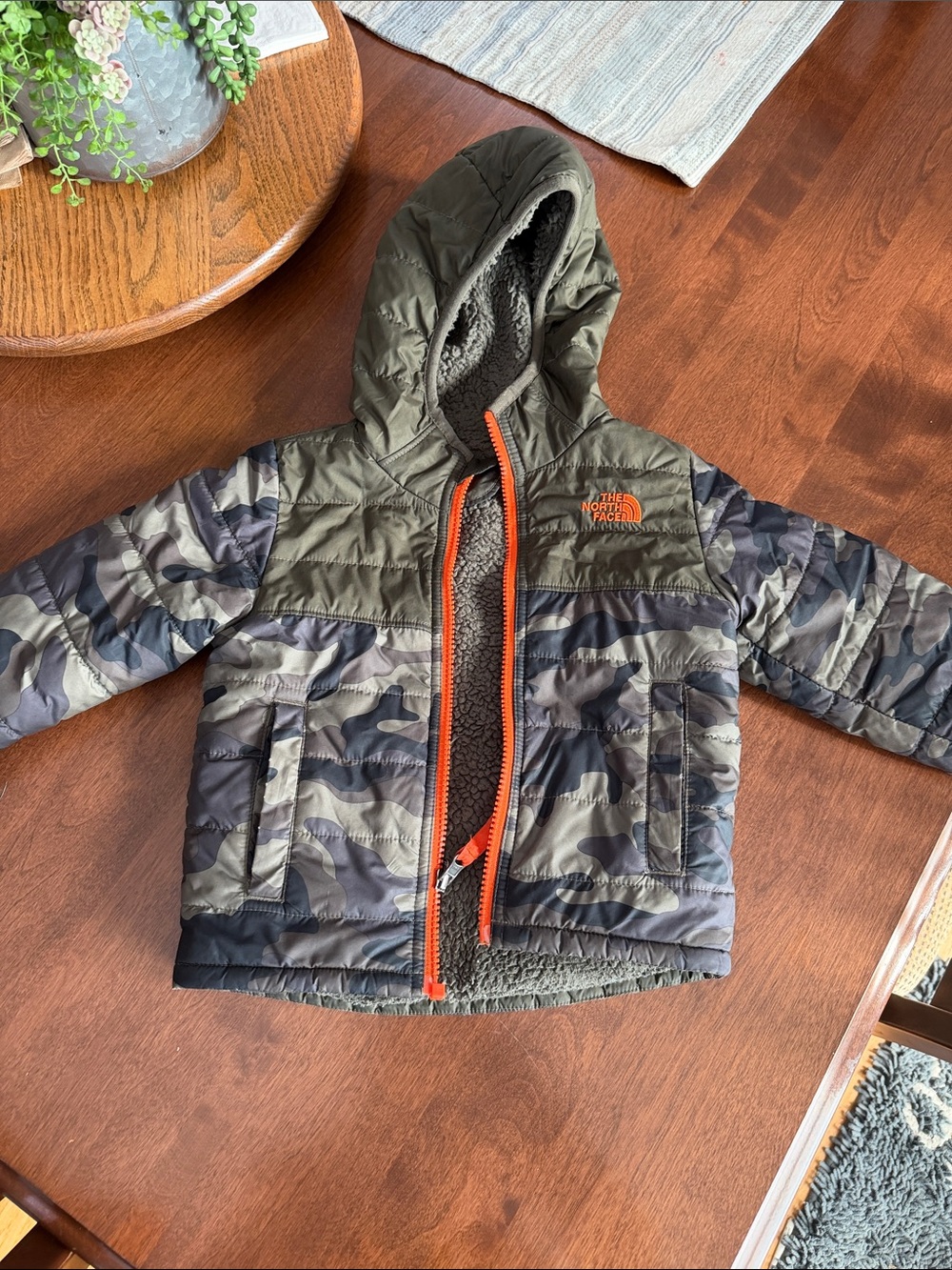 The North Face toddler boy reversible Olive Camo Hooded Puffer with Orange Trim